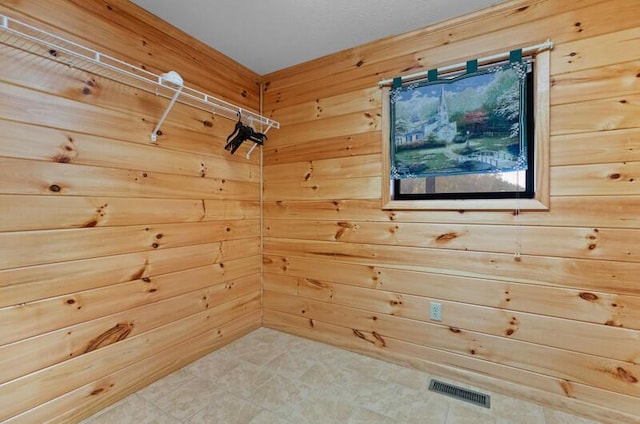 interior space featuring wood walls