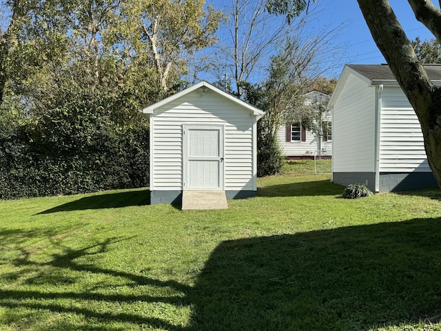 view of outdoor structure with a lawn