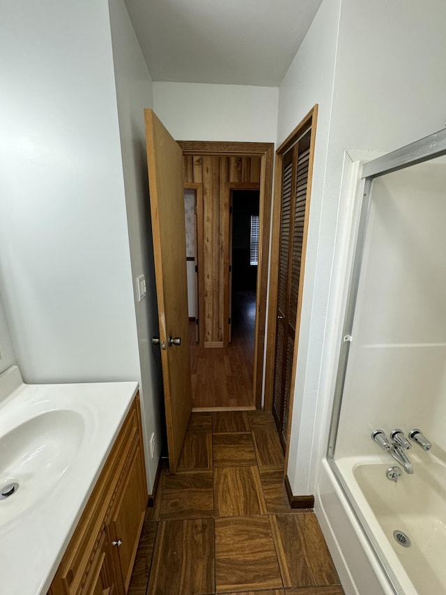 bathroom with a bath and vanity