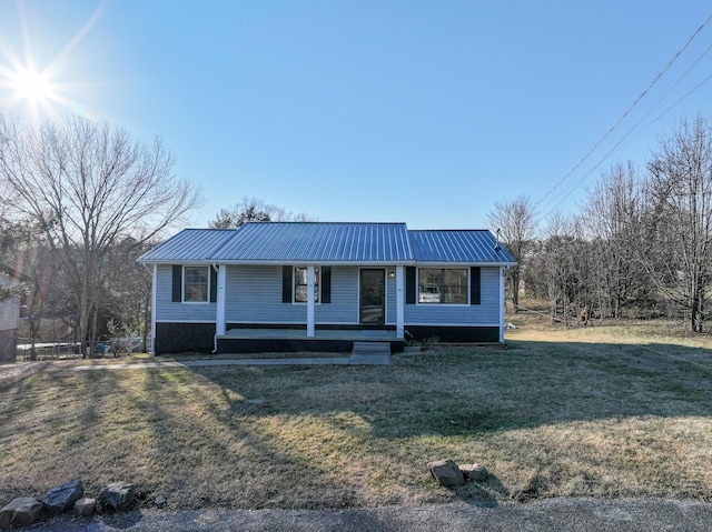 view of front of home with covered porch and a front yard