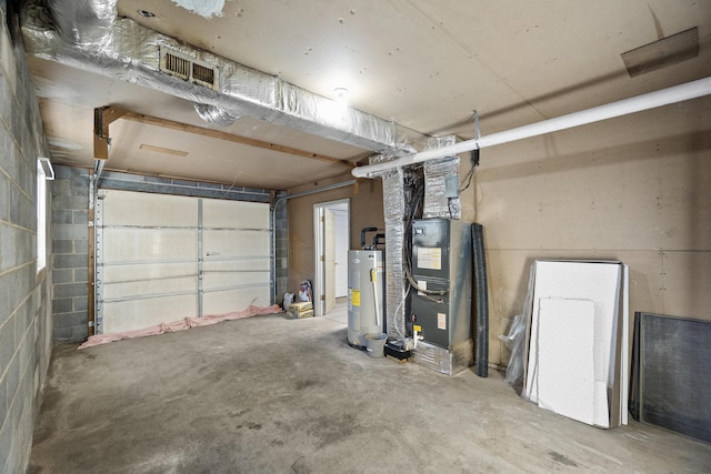 garage with heating unit and water heater