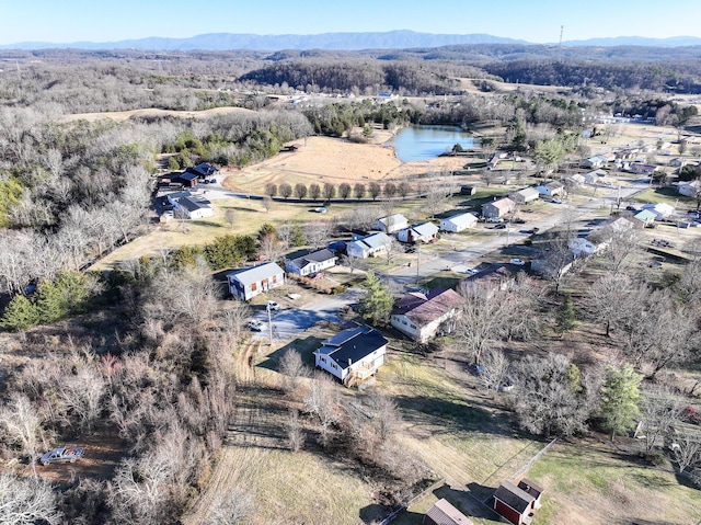 drone / aerial view with a water and mountain view