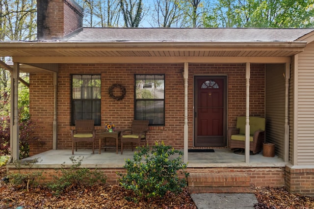 961 Woodway Dr, Morristown, TN 37814 - doorway to property with a porch, a chimney, and brick siding