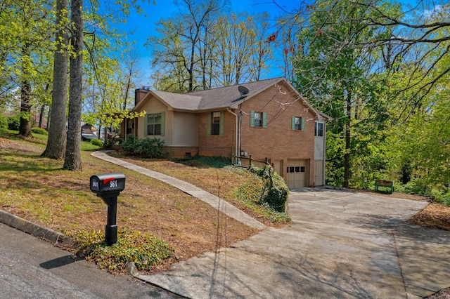 961 Woodway Dr, Morristown, TN 37814 - view of property exterior featuring brick siding, driveway, a chimney, and an attached garage