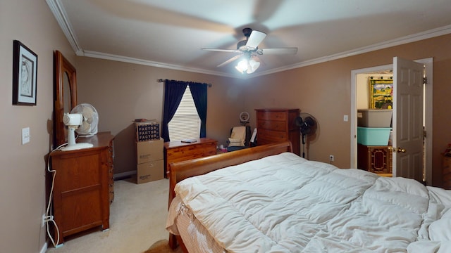 carpeted bedroom with ceiling fan and crown molding