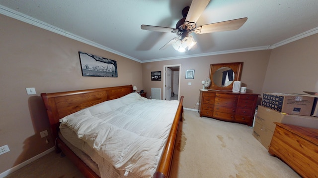 carpeted bedroom featuring ceiling fan and ornamental molding