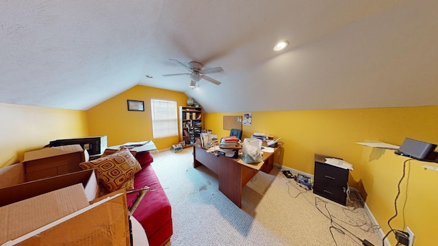 carpeted home office featuring a textured ceiling, ceiling fan, and lofted ceiling