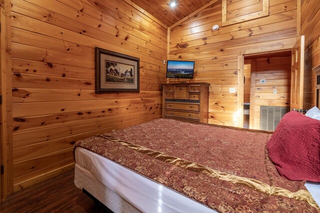 bedroom featuring vaulted ceiling, wooden ceiling, and wood walls