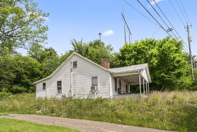 10741 Rutledge Pike, Blaine, TN 37709 - view of side of property with a chimney and metal roof