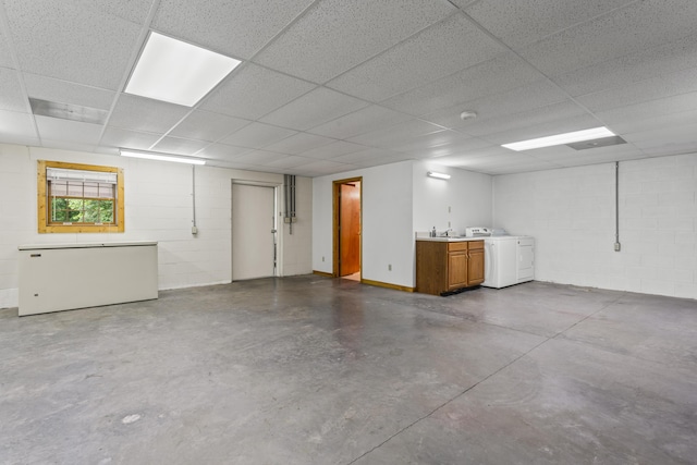 10741 Rutledge Pike, Blaine, TN 37709 - below grade area featuring concrete block wall, a paneled ceiling, and washing machine and clothes dryer