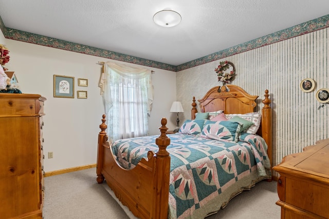 10741 Rutledge Pike, Blaine, TN 37709 - carpeted bedroom featuring baseboards, wallpapered walls, and a textured ceiling