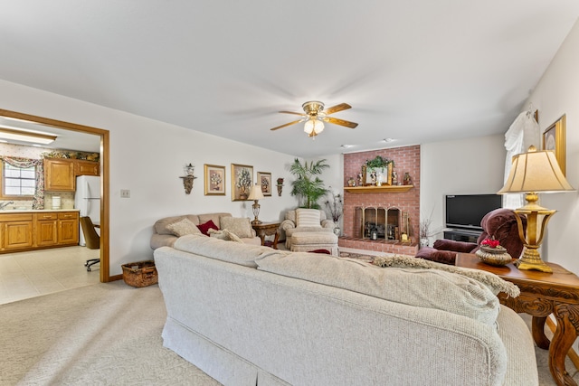 10741 Rutledge Pike, Blaine, TN 37709 - living room featuring ceiling fan, a brick fireplace, and baseboards
