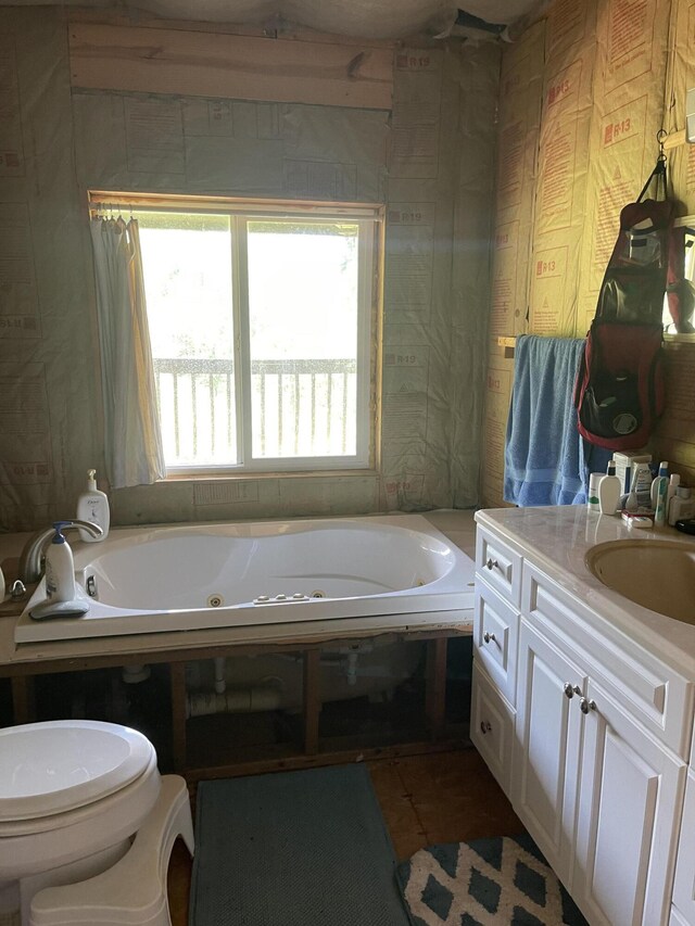4750 Laws Rd, Del Rio, TN 37727 - bathroom featuring a jetted tub, vanity, toilet, and tile patterned floors