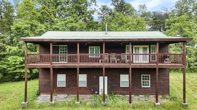 4750 Laws Rd, Del Rio, TN 37727 - rear view of house with metal roof and a lawn
