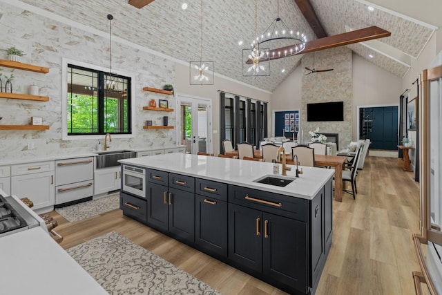 1670 Bays Mountain Rd, New Market, TN 37820 - kitchen featuring a sink, open shelves, white cabinetry, and high vaulted ceiling