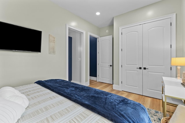 1670 Bays Mountain Rd, New Market, TN 37820 - bedroom featuring baseboards, recessed lighting, a closet, and light wood-type flooring