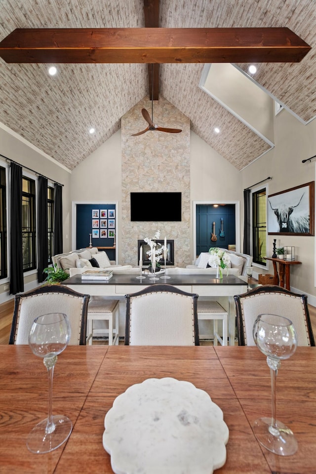 1670 Bays Mountain Rd, New Market, TN 37820 - dining area with wood finished floors, a ceiling fan, a stone fireplace, and high vaulted ceiling