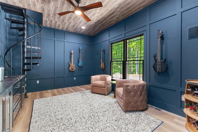 1670 Bays Mountain Rd, New Market, TN 37820 - sitting room featuring stairs, wood ceiling, a decorative wall, and light wood-type flooring