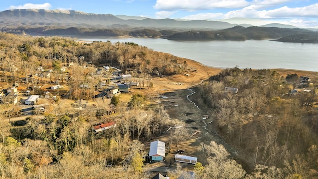 aerial view featuring a water and mountain view