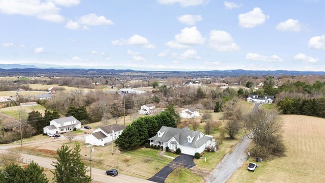 birds eye view of property with a mountain view