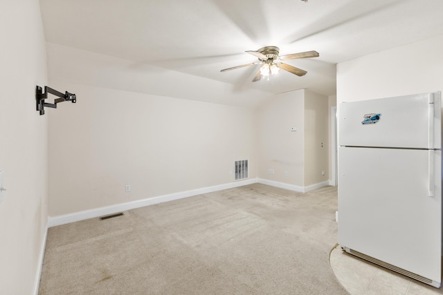 bonus room with light carpet, ceiling fan, visible vents, and lofted ceiling