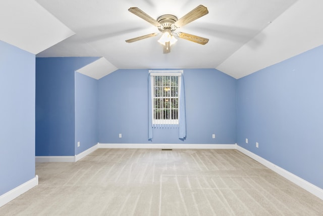 bonus room featuring carpet, ceiling fan, lofted ceiling, and baseboards