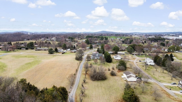 drone / aerial view featuring a mountain view and a rural view