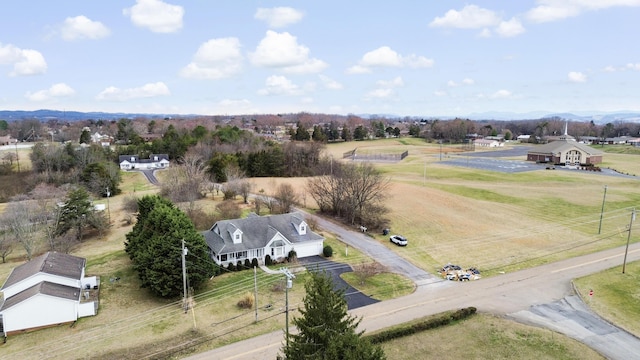 birds eye view of property with a rural view