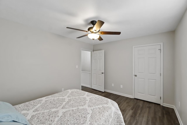 bedroom featuring ceiling fan and dark hardwood / wood-style flooring