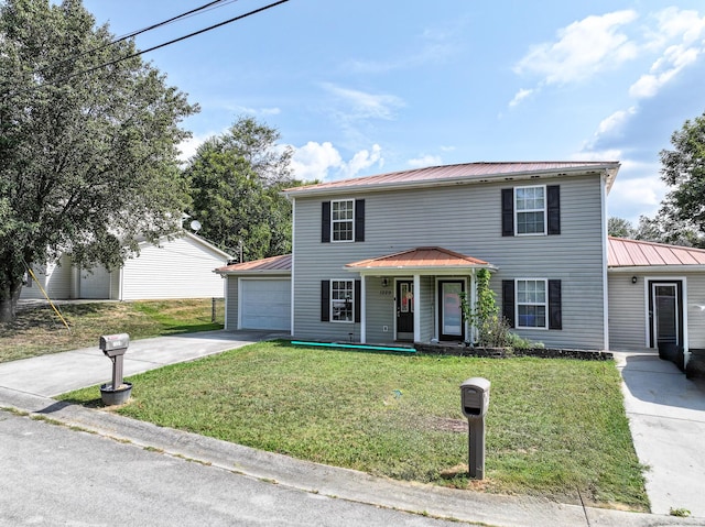 view of front facade with a front yard, a porch, and a garage