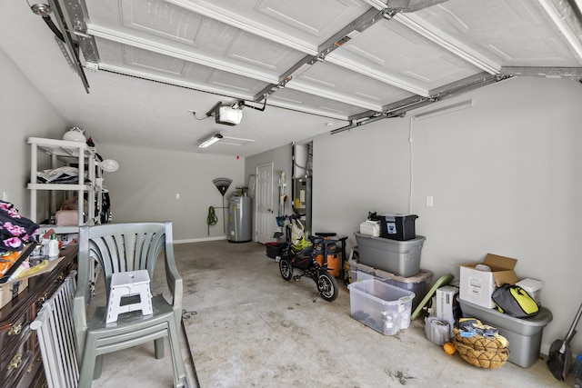 garage featuring a garage door opener and water heater