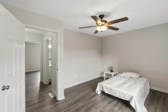 bedroom featuring ceiling fan and dark hardwood / wood-style flooring