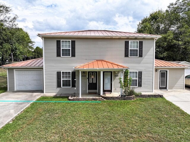 view of front facade featuring a porch, a garage, and a front lawn