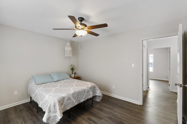 bedroom featuring ceiling fan and dark wood-type flooring