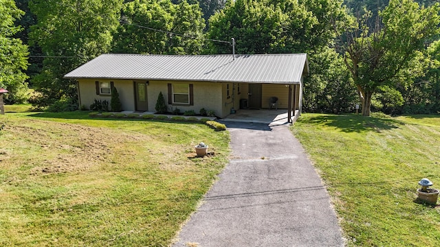 2368 Hall Rd, Dandridge, TN 37725 - single story home featuring stucco siding, a carport, driveway, a metal roof, and a front yard