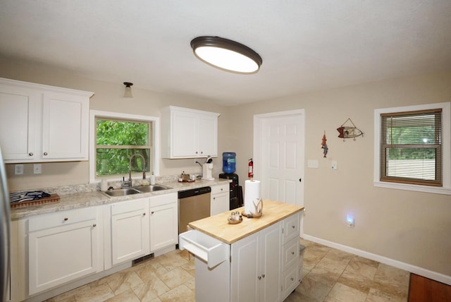 2368 Hall Rd, Dandridge, TN 37725 - kitchen with stainless steel dishwasher, wood counters, white cabinetry, a kitchen island, and light stone finish flooring