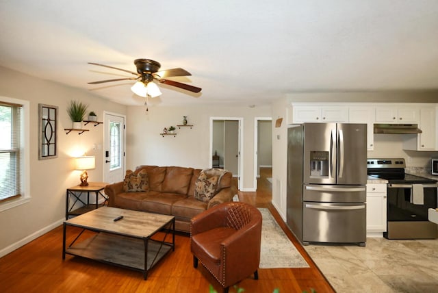2368 Hall Rd, Dandridge, TN 37725 - living room with a ceiling fan and light wood-style floors