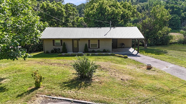 2368 Hall Rd, Dandridge, TN 37725 - ranch-style house featuring stucco siding, a carport, driveway, a metal roof, and a front yard