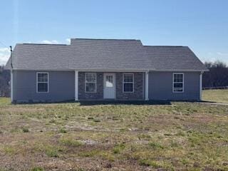 ranch-style house featuring a front lawn