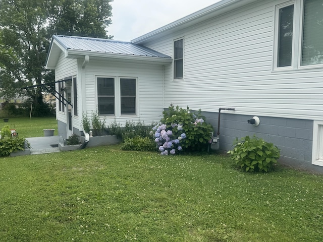 3207 Dove Ln, White Pine, TN 37890 - view of side of property featuring a lawn and a metal roof