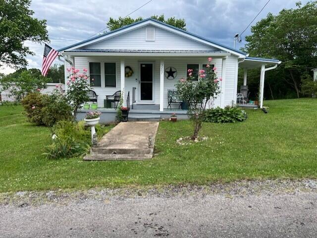 3207 Dove Ln, White Pine, TN 37890 - bungalow with covered porch and a front lawn