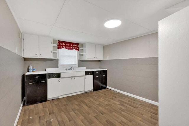 3207 Dove Ln, White Pine, TN 37890 - kitchen with open shelves, wood finished floors, white cabinetry, and light countertops