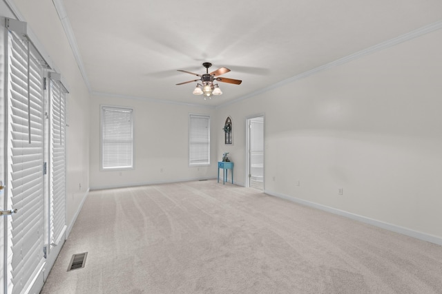 unfurnished bedroom with ceiling fan, light carpet, and ornamental molding