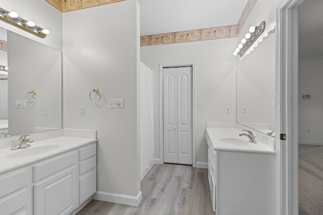 bathroom featuring vanity and hardwood / wood-style flooring