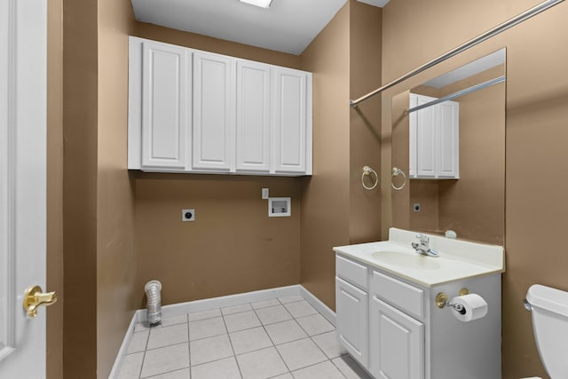 clothes washing area featuring electric dryer hookup, cabinets, sink, hookup for a washing machine, and light tile patterned floors