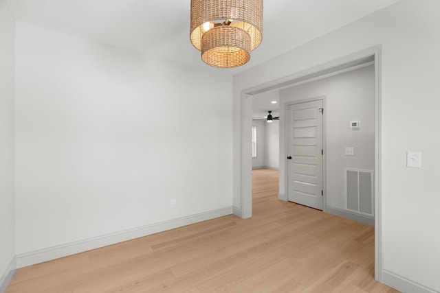 2490 Stream View Ln, Morristown, TN 37814 - empty room with a chandelier, light wood finished floors, and ceiling fan
