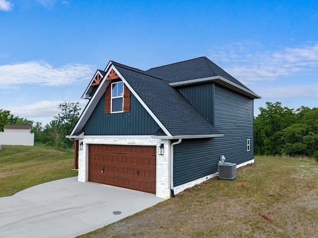 2490 Stream View Ln, Morristown, TN 37814 - view of side of property with roof with shingles, a yard, a garage, board and batten siding, and driveway