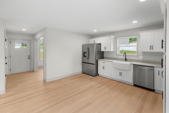 2490 Stream View Ln, Morristown, TN 37814 - kitchen featuring appliances with stainless steel finishes, recessed lighting, light wood-type flooring, plenty of natural light, and light stone counters