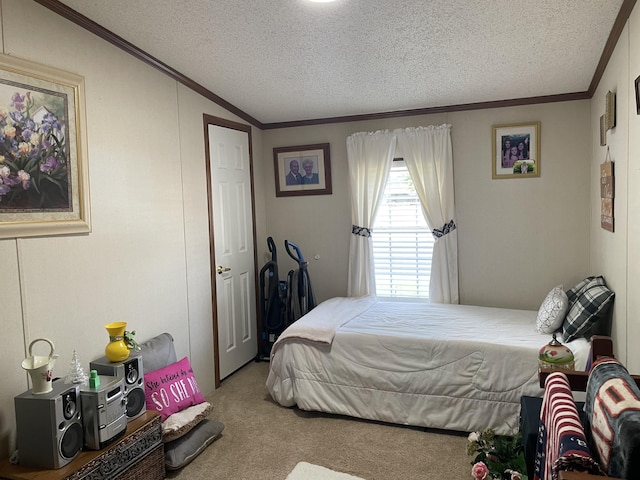 bedroom with carpet floors, a textured ceiling, and ornamental molding