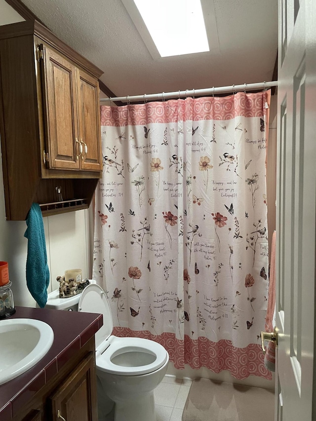 full bathroom with vanity, toilet, shower / bathtub combination with curtain, and a textured ceiling